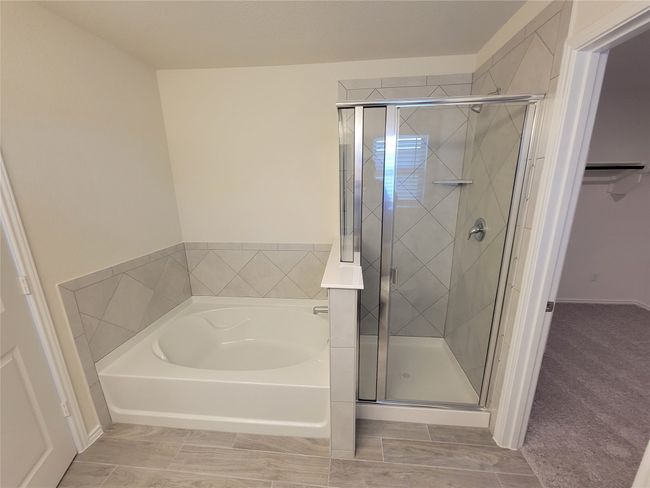 Bathroom with a garden tub and a stall shower | Image 22
