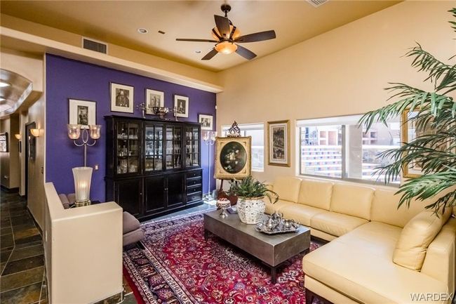 Living area with a ceiling fan | Image 45