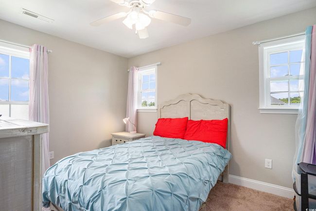 Carpeted bedroom with baseboards and ceiling fan | Image 17