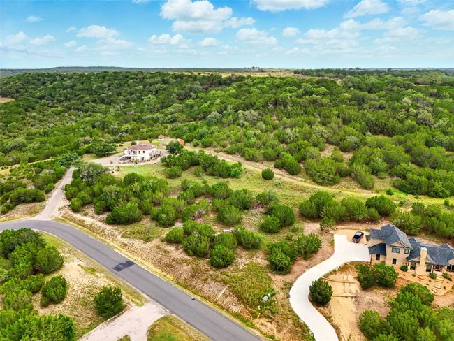 Aerial view of property and surrounding area with a forest | Image 4