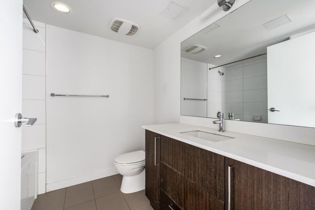 Bathroom featuring tile patterned floors, vanity, and recessed lighting | Image 19
