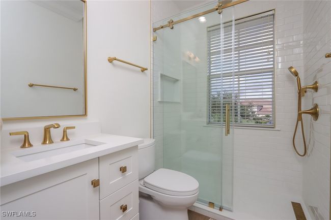 Full bathroom featuring a shower stall and vanity | Image 19