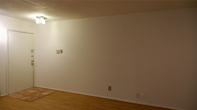 Spare room with wood-type flooring and a textured ceiling | Image 20