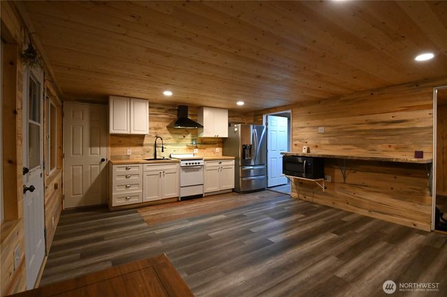 Open concept ~ live edge bar for entertaining or casual gatherings. | Image 28