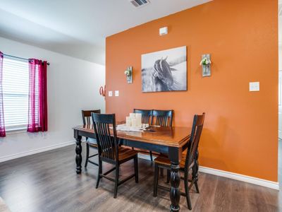 Dining room featuring dark hardwood / wood-style flooring | Image 3