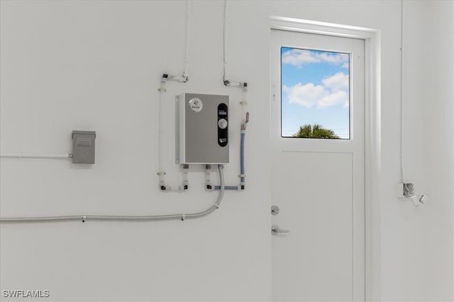 Utility room featuring water heater | Image 30