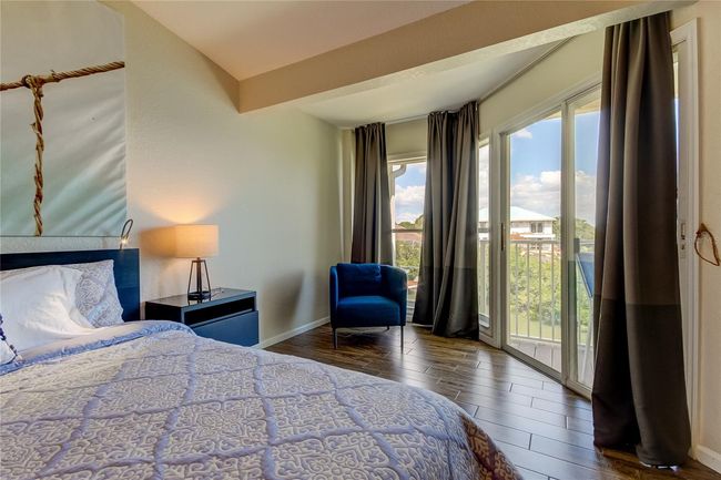 Primary Bedroom with Balcony Views | Image 26
