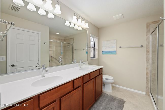 Spacious primary suite offers comfort, privacy, and a peaceful retreat. | Image 12