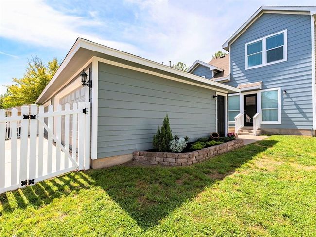 There's also a fenced-in backyard plus a two car detached garage with alley access. | Image 5