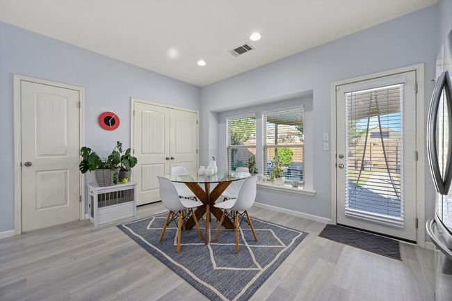 Dining space featuring recessed lighting, light wood-style floors, visible vents, and baseboards | Image 20