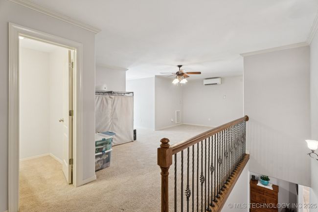 Upstairs game room with half-bath | Image 44