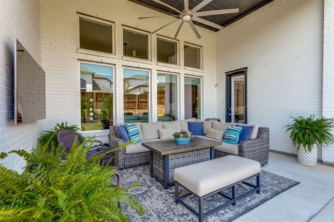 View of patio with outdoor lounge area and a ceiling fan | Image 37