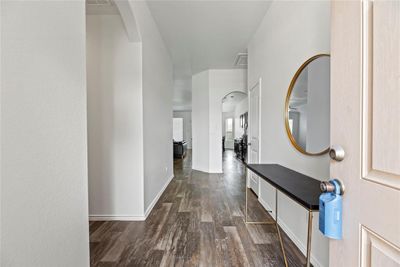 Inviting front entry with beautiful laminate flooring and a neutral paint color. | Image 3