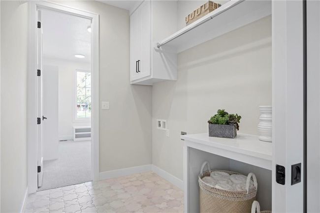 First floor laundry off the primary suite | Image 28