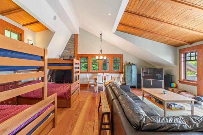 Living area with a chandelier, hardwood / wood-style flooring, and wooden ceiling | Image 28