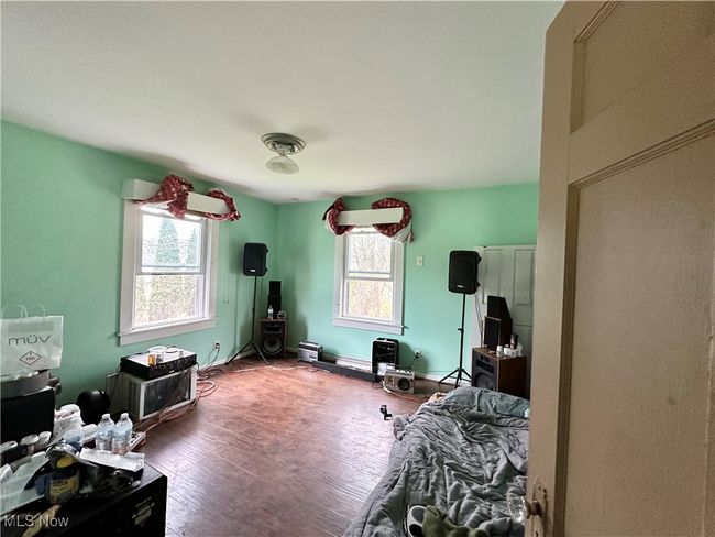 Bedroom featuring wood finished floors | Image 12