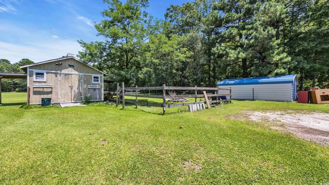 View of yard featuring an outbuilding | Image 23