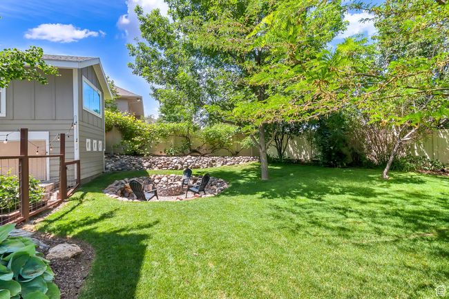 View of yard featuring a fire pit | Image 57