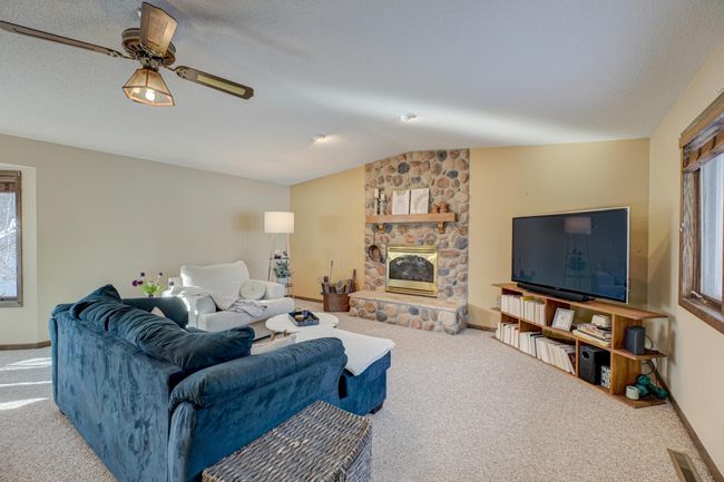 Escape to the family room with soaring vaulted ceilings and a spacious dining area—perfect for entertaining and making memories! | Image 13