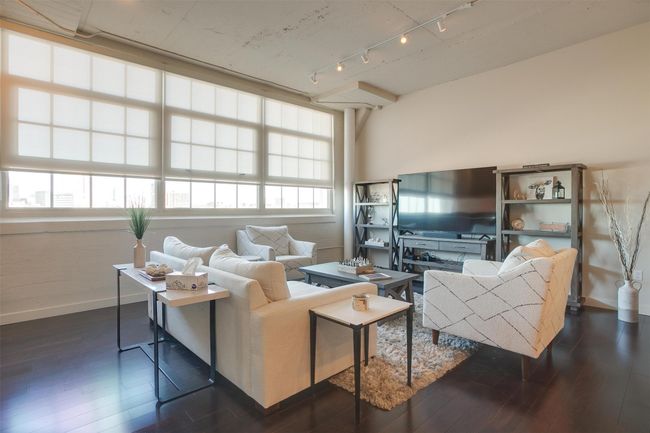 Living room featuring track lighting and dark wood-style floors | Image 18
