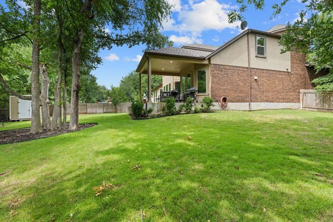 Back of house featuring stucco siding and brick siding | Image 35