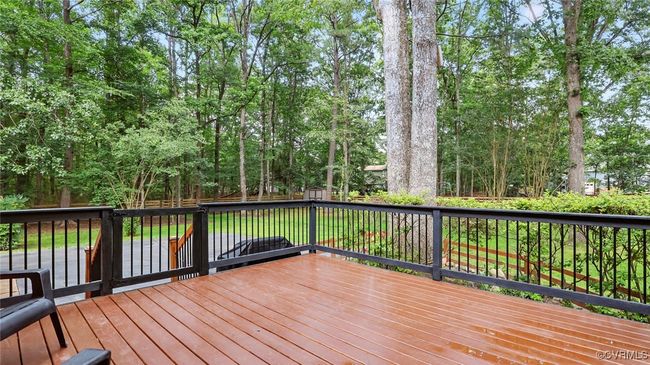 Deck featuring view of scattered trees | Image 12
