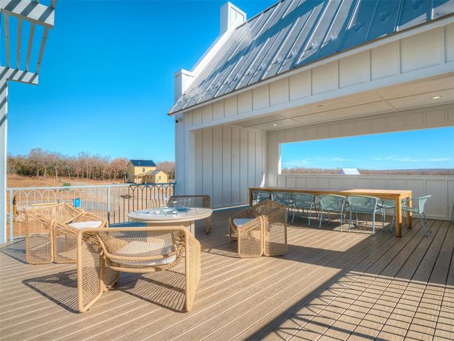 Wooden terrace featuring outdoor dining space | Image 45