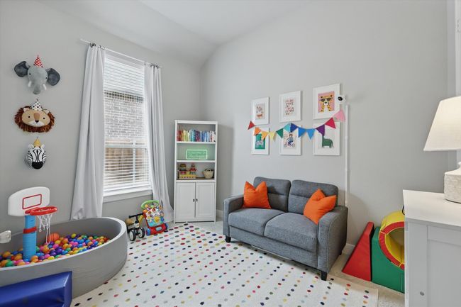 Rec room with carpet and lofted ceiling | Image 16