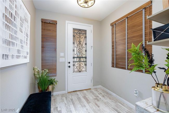 Foyer entrance featuring wood finished floors and baseboards | Image 7
