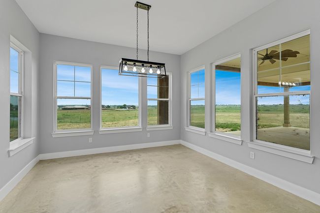 Unfurnished sunroom featuring a chandelier | Image 10