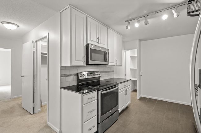 Two large pantries in this home - one on the left and one on the right. | Image 10