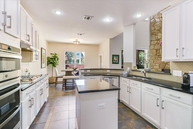 Stainless steel appliances with plenty of counter space. | Image 8