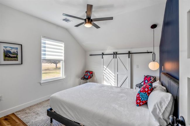Another upstairs bedroom in the other building—filled with natural light and finished with modern touches and thoughtful details. | Image 35