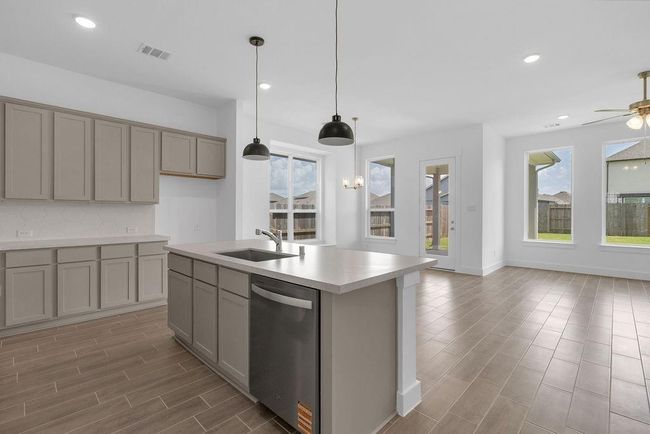 The open layout invites laughter and warmth, making it the perfect backdrop for family gatherings or cozy brunches with friends. | Image 6