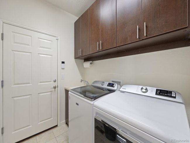 Laundry room complete with cabinetry and sink | Image 30
