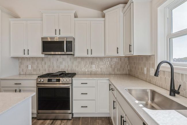 (*Photo of actual home) Another view of the kitchen | Image 4