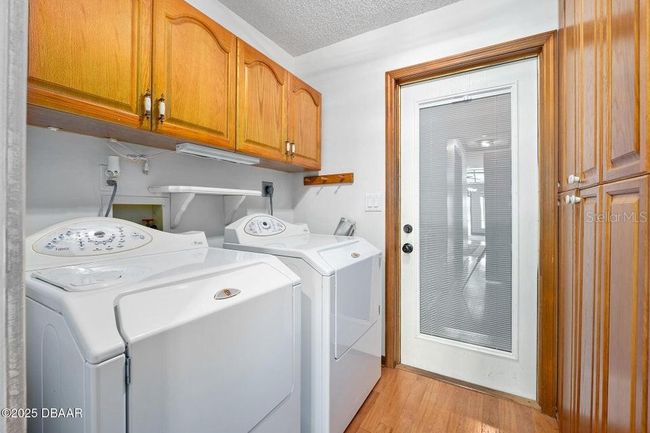 Laundry inside near garage | Image 9