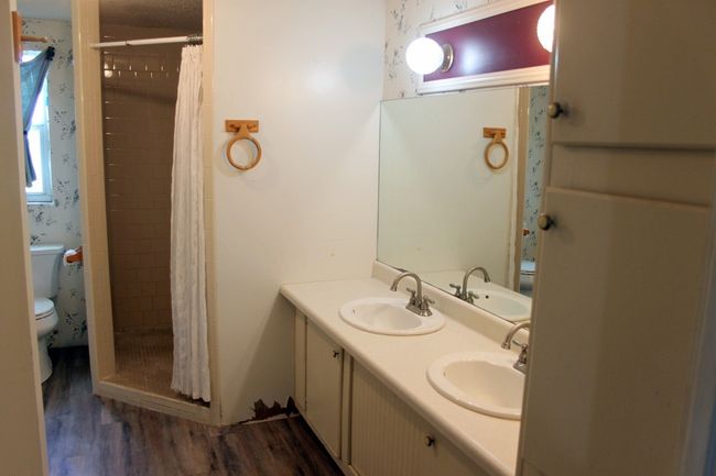 Full bath with toilet, wood finished floors, a stall shower, and double vanity | Image 16