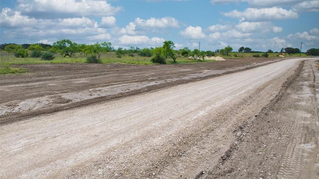 View of dirt / gravel road with a view of countryside | Image 16
