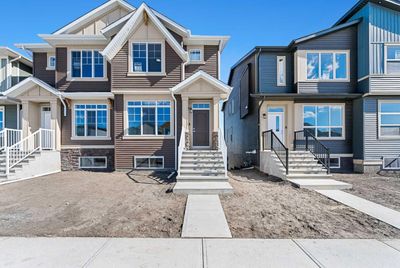 156 Edith Way Nw, Home with 3 bedrooms, 2 bathrooms and 2 parking in Calgary AB | Image 1