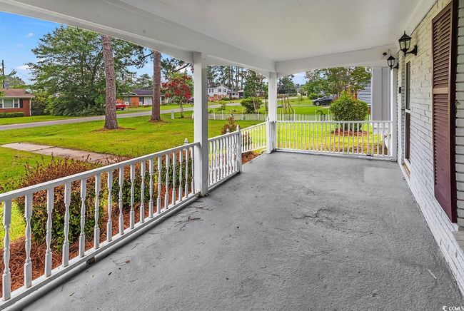 Covered porch with a lawn | Image 28