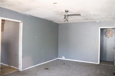 Unfurnished room with carpet flooring and ceiling fan | Image 3