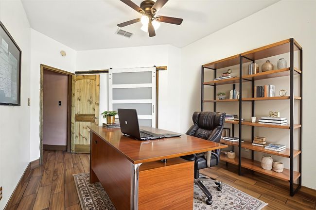 Home office with a ceiling fan and dark wood-style flooring | Image 17