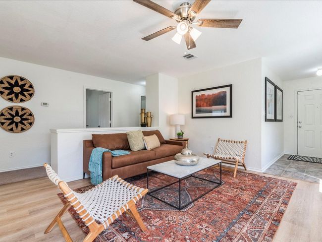 The whole interior boasts fresh neutral paint on the walls, ceilings & trim for a seamless move-in experience. | Image 11