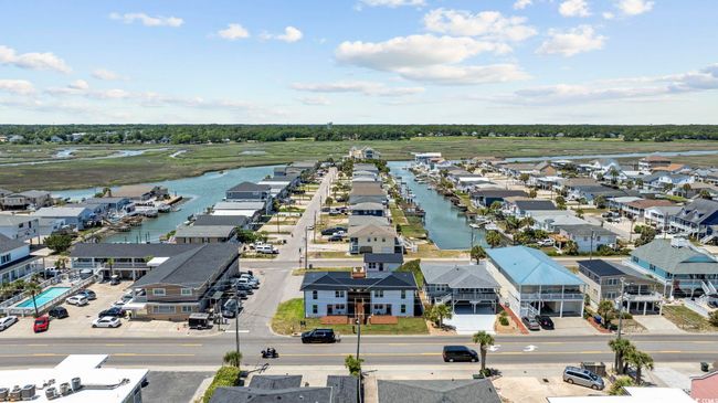 Aerial perspective of suburban area featuring a large body of water | Image 40
