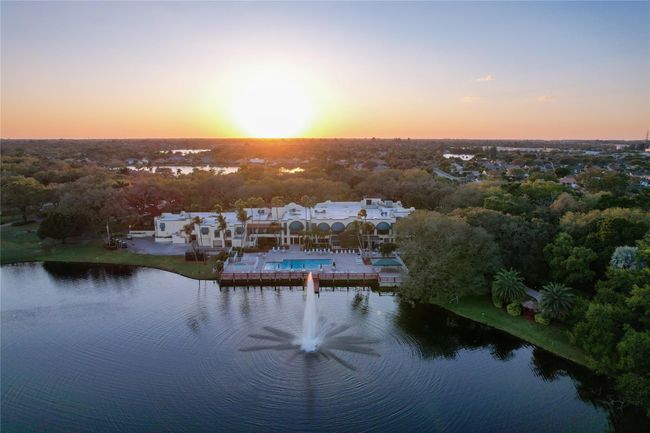 Drone Sunset Of Country Club Pool And Lake And Water Fountain | Image 47