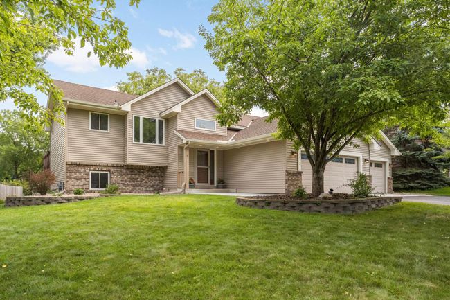 Start your next chapter in this immaculately maintained Champlin home and enjoy life surrounded by the beauty of the Elm Creek Park Reserve. | Image 5