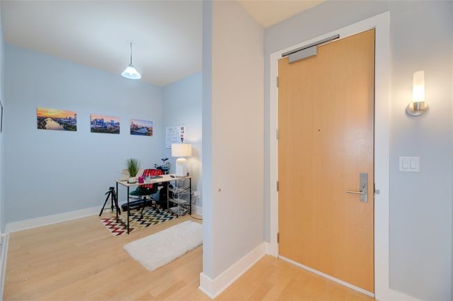 Entrance foyer with wood finished floors and baseboards | Image 21