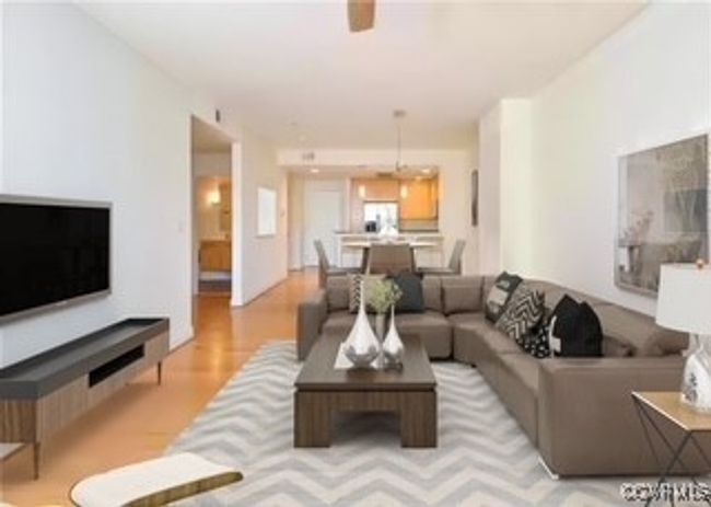 Living area with wood finished floors | Image 4