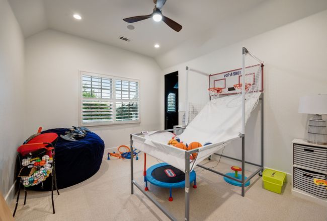 Rec room with ceiling fan, carpet flooring, vaulted ceiling, and recessed lighting | Image 30